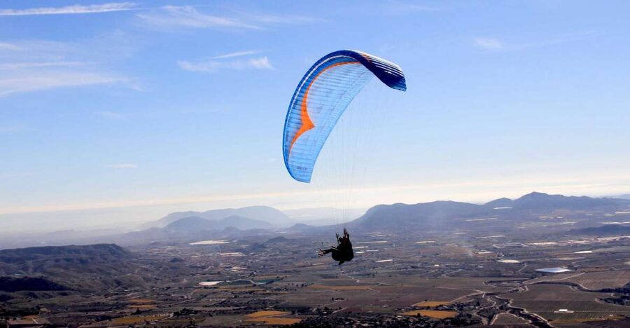Alicante and Santa Pola: Tandem Paragliding Flight - Preparing for takeoff on the mountain