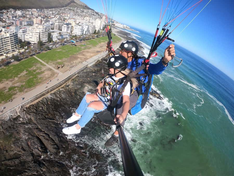 Cape Town: Tandem Paragliding Flight with the Experts - Landing near the ocean and returning uphill