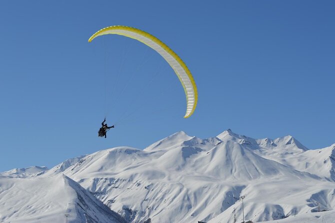 Cloudbase Paragliding in Gudauri, Georgia - Taking off above Gudauri