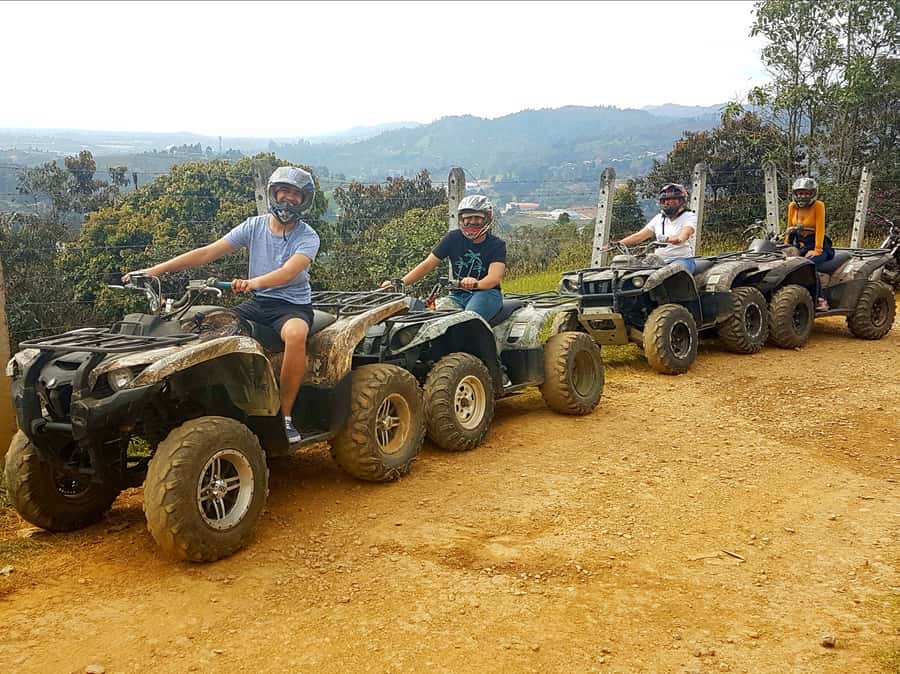 From Medellín: ATV and Waterfall Paragliding Tour - Preparing for the flight above the canyon