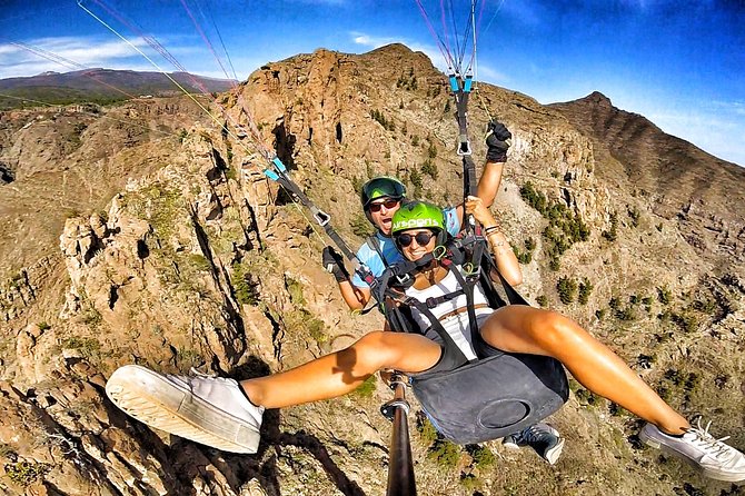 GOLD paragliding flight including videos/photos, t-shirt and a bottle of Cava - From the Costa Adeje pickup to the takeoff hill