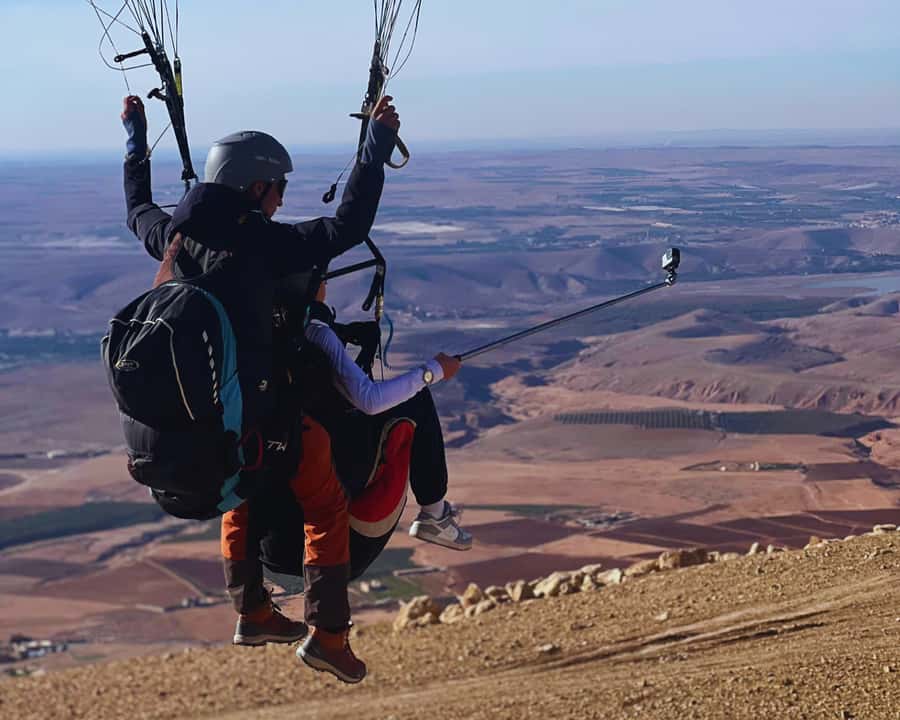 Marrakech: Atlas Mountains Paragliding Tour with Video - Getting ready for a tandem flight