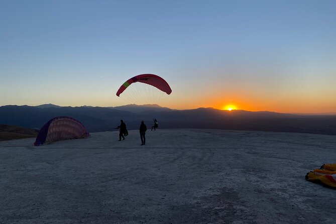 Marrakech : Paragliding & Atlas Mountains Trip - Preparing for the launch on a grassy slope