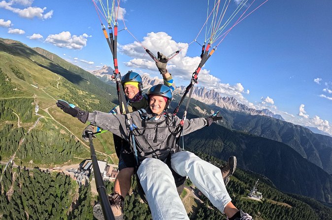 Paragliding adventure Plose/Brixen Dolomites for nature lovers - The view over forests, meadows, and peaks