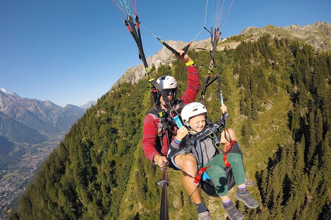 Paragliding Tandem Flight over the Alps in Chamonix - Trying the controls with your pilot nearby