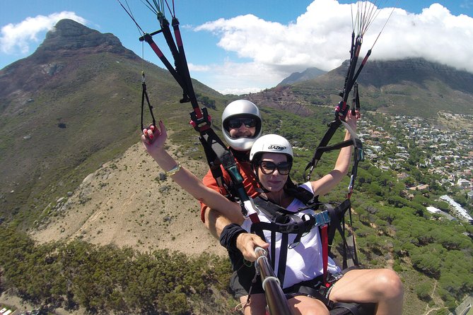 Tandem Paragliding Cape Town Experience TABLE MOUNTAIN PARAGLIDE - Landing near the ocean and returning to the meeting point