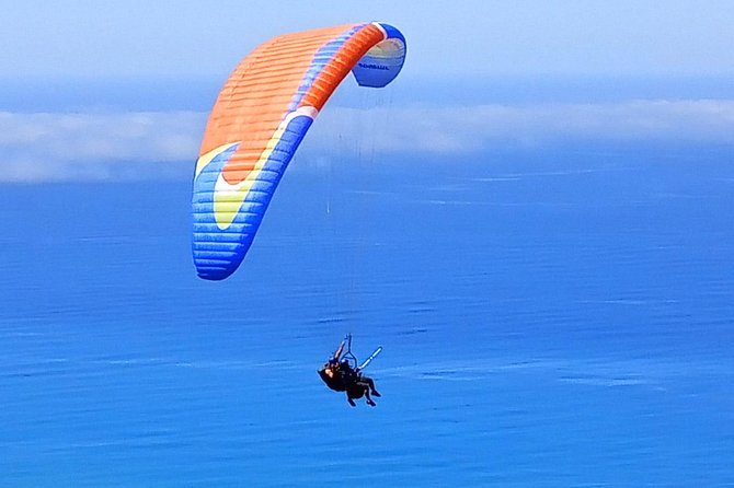 Tandem Paragliding Flight in Taormina - The views over canyons, Etna, and the sea
