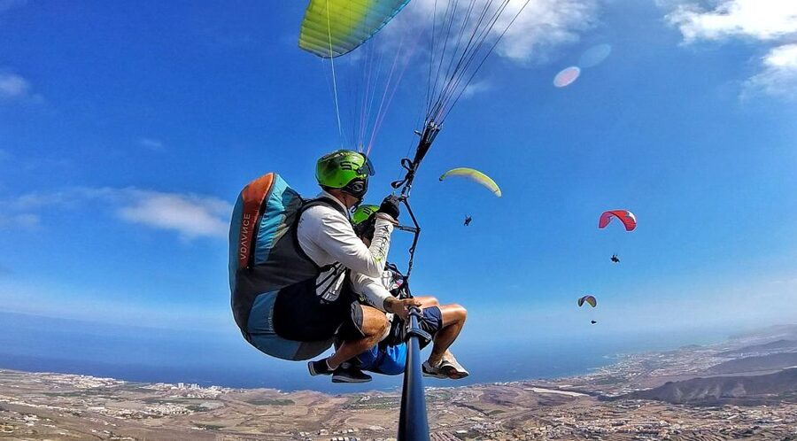Tenerife: Tandem Paragliding Flight with Pickup - Getting ready with a harness, helmet, and briefing