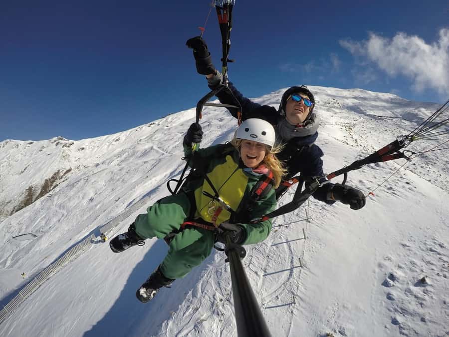 Wanaka: Tandem Paragliding Experience - Finding the landing field beside the Treble Cone gate